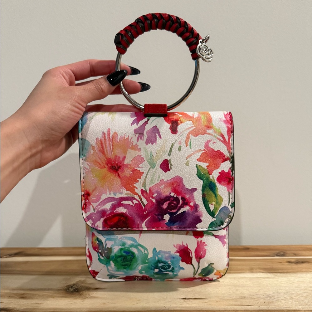 Floral Handbag + Ring Handle and Rose Key Tag
Carlos Santana